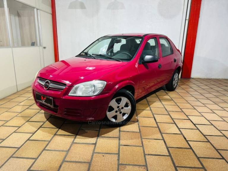 CHEVROLET - PRISMA - 2009/2009 - Vermelha - R$ 17.900,00